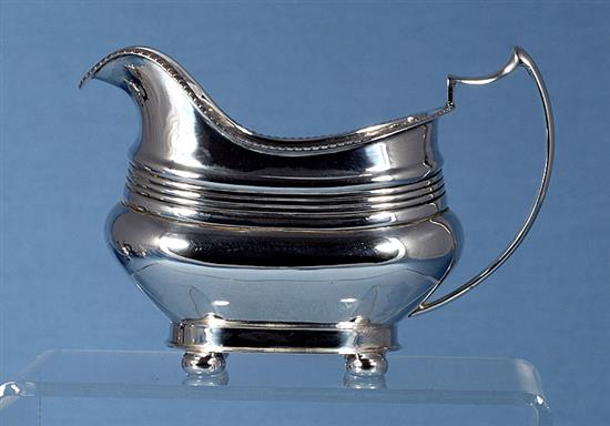 A 1940s silver three piece tea set, by William Bush & Sons, teapot height 156mm, gross weight 41.2oz/1283grms
